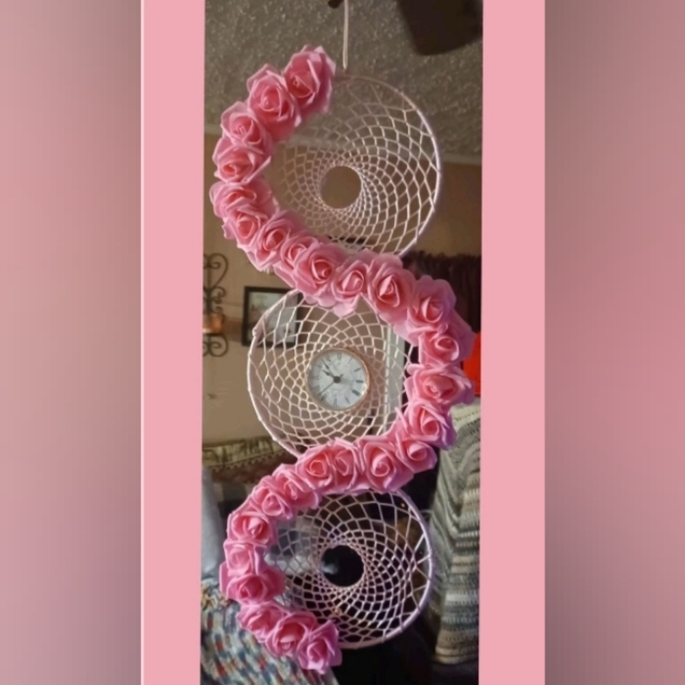 A pink  rose dream catcher clock
